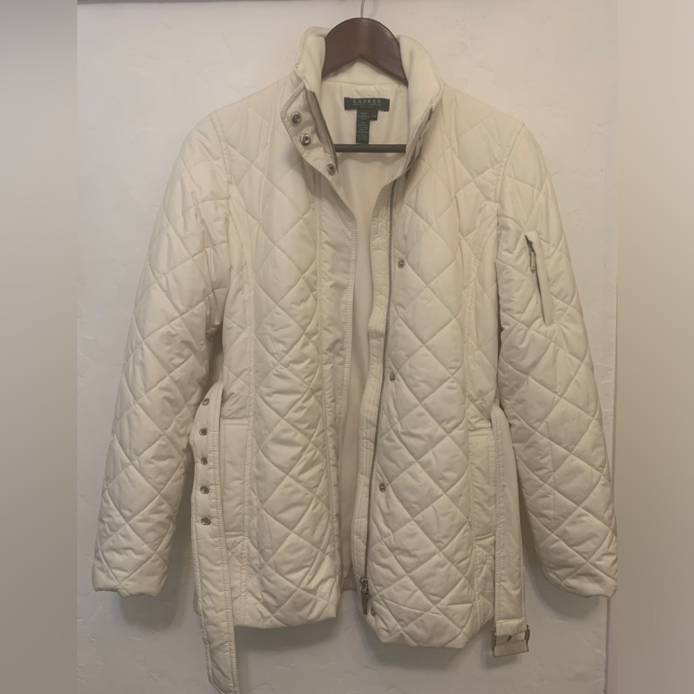 Cream colored quilted and belted jacket